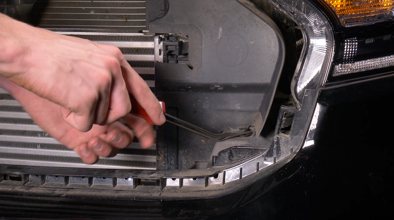 A man works on instlalling the Morimoto XB LED Headlights on the 2019+ Ford Ranger.