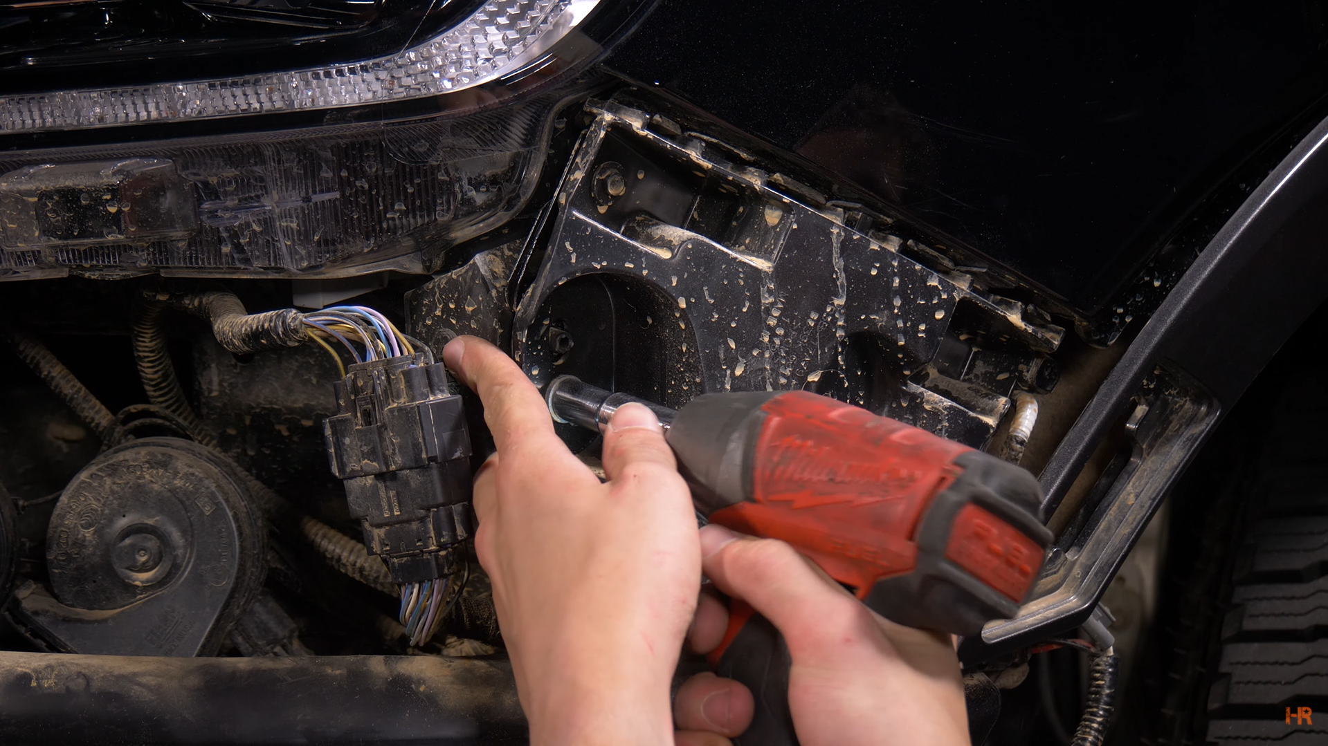 A man works on instlalling the Morimoto XB LED Headlights on the 2019+ Ford Ranger.